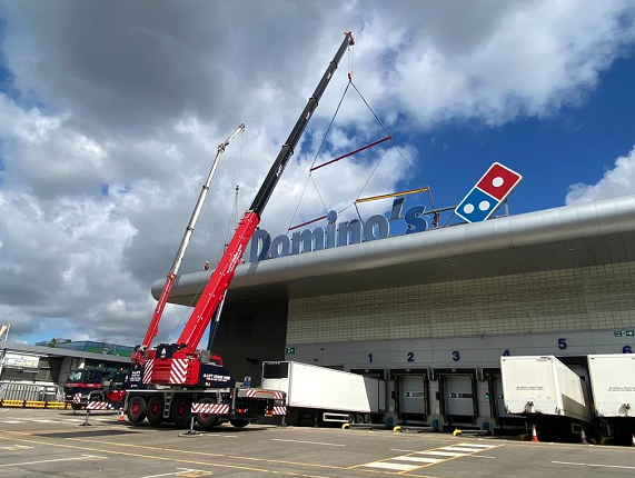 Contract Lift crane hire to lift Dominos signage in Milton Keynes